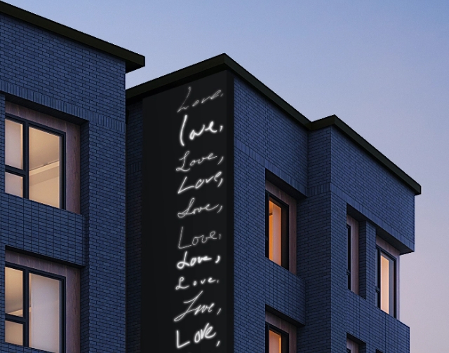 exterior of The Laureate student apartments with art installation